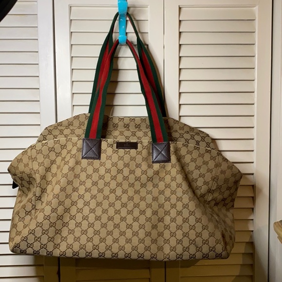 Gucci Handbags - Pre-Loved Gucci Carryon Logo Canvas Duffle Bag…